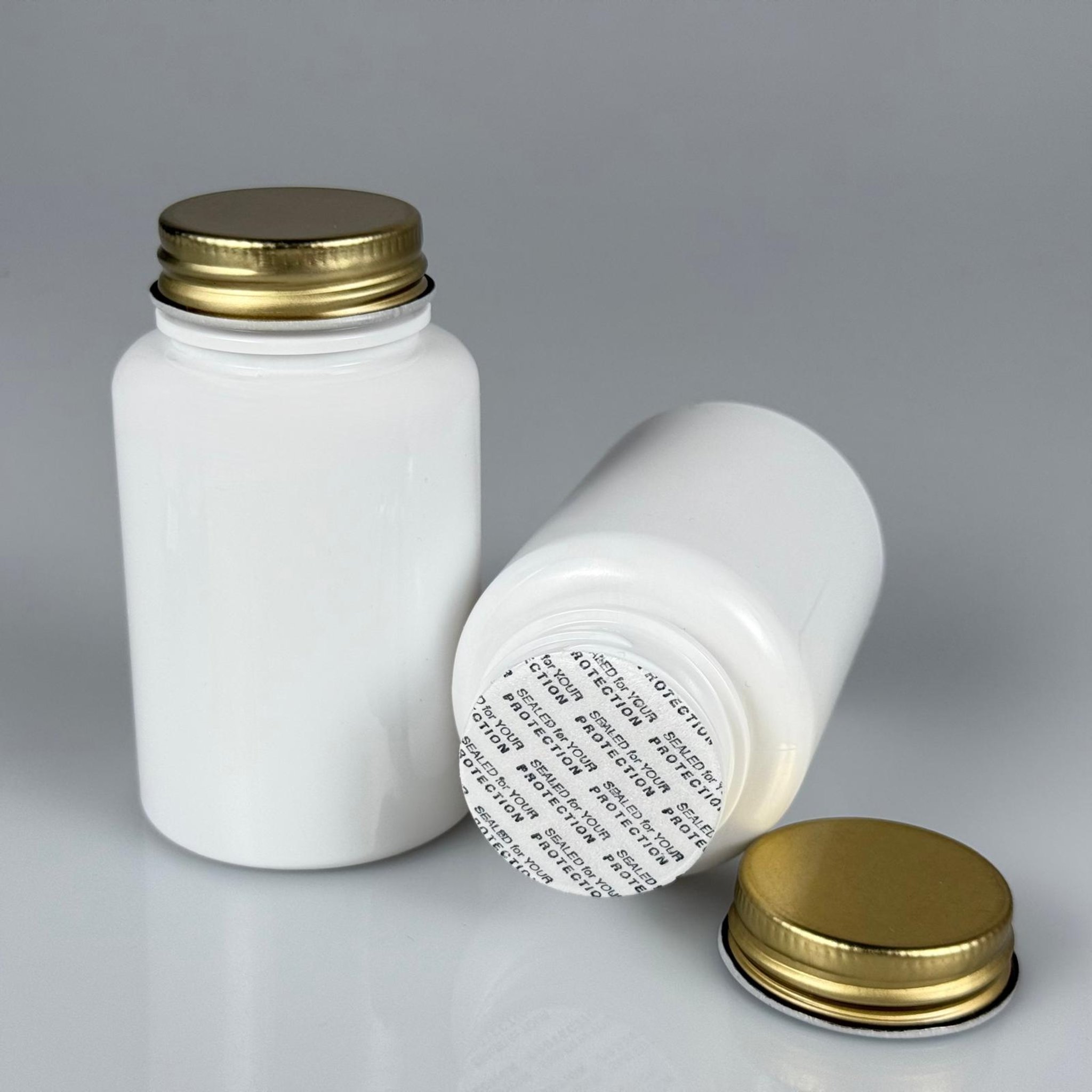 150 CC BEYAZ PET TABLET ŞİŞESİ - GOLD METAL KAPAKLI + KENDİNDEN YAPIŞKANLI KÖPÜK CONTALI - 150 ML KAPSÜL KUTUSU - İLAÇ ŞİŞESİ - MEDİKAL HAP ŞİŞESİ - FARMASÖTİK KAVANOZ